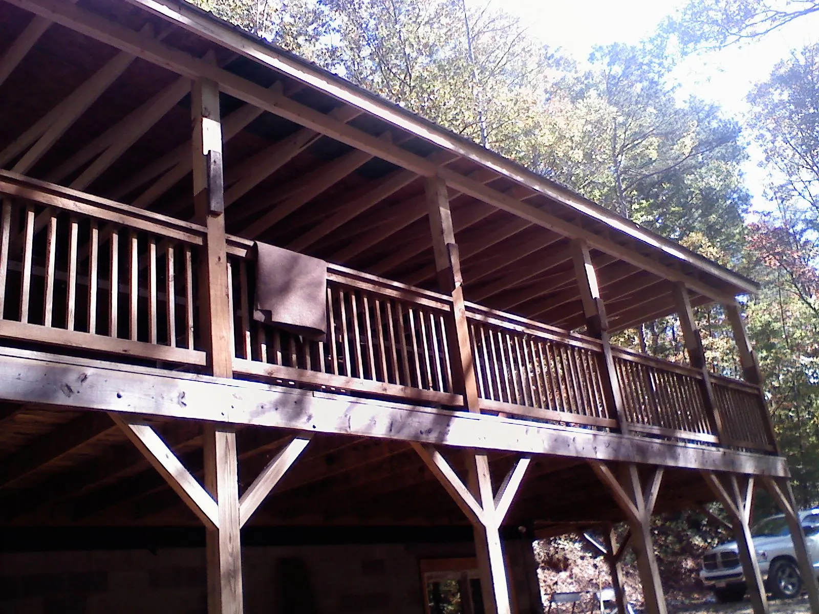 Timber framing under a new elevated porch and deck — Roof Leak Repair in White Lake by Roofing Brothers